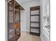 This walk-in closet features adjustable wood shelves and plenty of storage space at 801 W Anderson St, Orlando, FL 32805