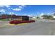 Street view showcasing a welcoming entrance with signage and colorful landscaping at 3245 Sustainable Way, Kissimmee, FL 34747
