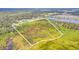 Expansive aerial view of land surrounded by trees with potential for development and serene natural beauty at 4750 Rummell Rd, Saint Cloud, FL 34771