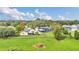 Aerial view of a property featuring a screened pool, detached garage, fenced yard, and lush landscaping at 4750 Rummell Rd, St Cloud, FL 34771
