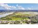 Large property with a mix of homes, open fields, and a tranquil lake at 4750 Rummell Rd, St Cloud, FL 34771