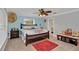 Bedroom featuring carpet floors, ceiling fan and colorful decor at 4750 Rummell Rd, Saint Cloud, FL 34771