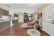 Inviting entryway flows into the living area, showcasing wood-look floors and lots of natural light at 4750 Rummell Rd, St Cloud, FL 34771