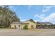 Charming single-story home features a covered lanai, mature landscaping, and a welcoming entrance at 4750 Rummell Rd, St Cloud, FL 34771