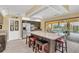 Stylish kitchen featuring stainless steel appliances, island with bar seating, and access to patio at 4750 Rummell Rd, St Cloud, FL 34771