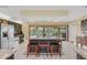 Modern kitchen with stainless steel appliances, large center island, and view of outdoor swimming pool at 4750 Rummell Rd, St Cloud, FL 34771