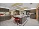 Spacious kitchen with wood cabinets, granite counters, stainless appliances and center island at 4750 Rummell Rd, St Cloud, FL 34771