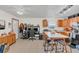 Open-concept living area showcasing kitchen features, casual dining and an adjacent workspace, perfect for modern living at 4750 Rummell Rd, St Cloud, FL 34771