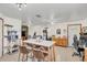 Open-concept living room with tile flooring, modern lighting, dining table, and pet towers at 4750 Rummell Rd, St Cloud, FL 34771