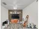 Cozy living room with a decorative wall, stylish decor, and ample space for relaxation and entertainment at 4750 Rummell Rd, St Cloud, FL 34771