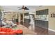 Expansive living space with open floor plan, wood floors, and seamless flow into a modern kitchen at 4750 Rummell Rd, St Cloud, FL 34771