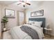 Comfortable bedroom featuring a stylish bed, minimalist decor, and natural light from the window at 8677 Pinter St, Orlando, FL 32827