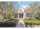 Charming two-story home with manicured lawn and inviting front porch in a tranquil neighborhood at 8677 Pinter St, Orlando, FL 32827