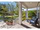 Inviting front porch with brick pavers and comfortable seating, perfect for enjoying the landscaped front yard at 8677 Pinter St, Orlando, FL 32827