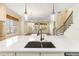 Open concept kitchen featuring a central island with sink, and view of Gathering room at 8677 Pinter St, Orlando, FL 32827