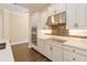 Modern kitchen with white cabinets, stainless steel appliances, and stylish backsplash at 8677 Pinter St, Orlando, FL 32827