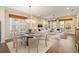 Comfortable living space with dining area, featuring a chandelier and modern furnishings at 8677 Pinter St, Orlando, FL 32827