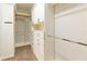 Spacious walk-in closet with custom built-in shelving, drawers, and hanging rods at 8677 Pinter St, Orlando, FL 32827