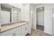 Bathroom boasts double vanity, granite countertop, and walk-in shower at 2106 Rosewood Dr, Bartow, FL 33830