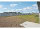 Private backyard with grassy area and privacy wall at 2149 Rosewood Dr, Bartow, FL 33830