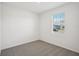 Spacious bedroom with neutral carpeting and a large window at 2149 Rosewood Dr, Bartow, FL 33830