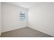 Simple bedroom with carpeted floor and window with blinds at 2149 Rosewood Dr, Bartow, FL 33830