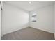 Simple bedroom with neutral carpeting and a window at 2149 Rosewood Dr, Bartow, FL 33830