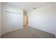 Bright bedroom with neutral carpeting and double-door closet at 2149 Rosewood Dr, Bartow, FL 33830
