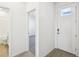 Bright and airy entryway with tile flooring and access to bathroom and bedroom at 2149 Rosewood Dr, Bartow, FL 33830