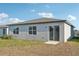 Rear view of house showcasing sliding glass door at 2149 Rosewood Dr, Bartow, FL 33830