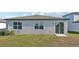 Rear view of house showcasing sliding glass door at 2149 Rosewood Dr, Bartow, FL 33830