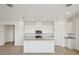 Modern kitchen with white cabinets, granite countertops and an island at 2149 Rosewood Dr, Bartow, FL 33830