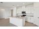 Modern kitchen featuring white cabinets, granite countertops, and stainless steel appliances at 2149 Rosewood Dr, Bartow, FL 33830