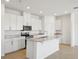 Modern kitchen with white cabinets, granite countertops and island at 2149 Rosewood Dr, Bartow, FL 33830