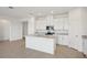 Open concept kitchen with white cabinets and granite countertops at 2149 Rosewood Dr, Bartow, FL 33830