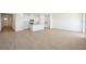 Open concept kitchen with white cabinets and granite countertops at 2149 Rosewood Dr, Bartow, FL 33830