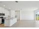 Open concept kitchen features white cabinets, granite countertops, and stainless steel appliances at 2149 Rosewood Dr, Bartow, FL 33830