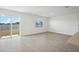 Open concept living room with tile floors and sliding glass doors at 2149 Rosewood Dr, Bartow, FL 33830