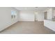 Spacious living area with tile flooring and sliding glass doors leading to backyard at 2149 Rosewood Dr, Bartow, FL 33830