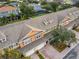 Aerial view of townhouses with garages, well-kept landscaping, and community amenities at 3529 Sanctuary Dr, St Cloud, FL 34769