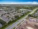 Community with townhouses, green spaces, and convenient access to roads and amenities at 3529 Sanctuary Dr, St Cloud, FL 34769