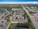 Townhouse community bordering a pond, featuring neat landscaping and easy access to the highway at 3529 Sanctuary Dr, St Cloud, FL 34769