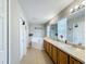 Bright bathroom showcases a dual-sink vanity and soaking tub at 3529 Sanctuary Dr, St Cloud, FL 34769