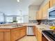 Modern kitchen with stainless steel appliances, a breakfast bar, and plenty of counter space at 3529 Sanctuary Dr, St Cloud, FL 34769