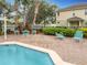 The community pool features inviting lounge chairs and meticulous landscaping for a peaceful outdoor experience at 3529 Sanctuary Dr, St Cloud, FL 34769