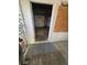 Interior entryway featuring boarded window and damaged flooring into a home under renovation at 1805 W 15Th St # 1/2, Sanford, FL 32771