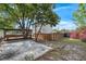 Spacious backyard features mature trees and seating area at 2201 Delaney. Ave, Orlando, FL 32806
