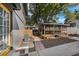 Charming backyard with covered gazebo, stone pathway and mature trees at 2201 Delaney. Ave, Orlando, FL 32806