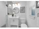 Stylish bathroom with modern vanity, new fixtures, glass enclosed shower, and geometric tile at 2201 Delaney. Ave, Orlando, FL 32806