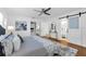 Inviting bedroom features hardwood floors, ensuite bathroom, walk-in closet, and bright windows at 2201 Delaney. Ave, Orlando, FL 32806